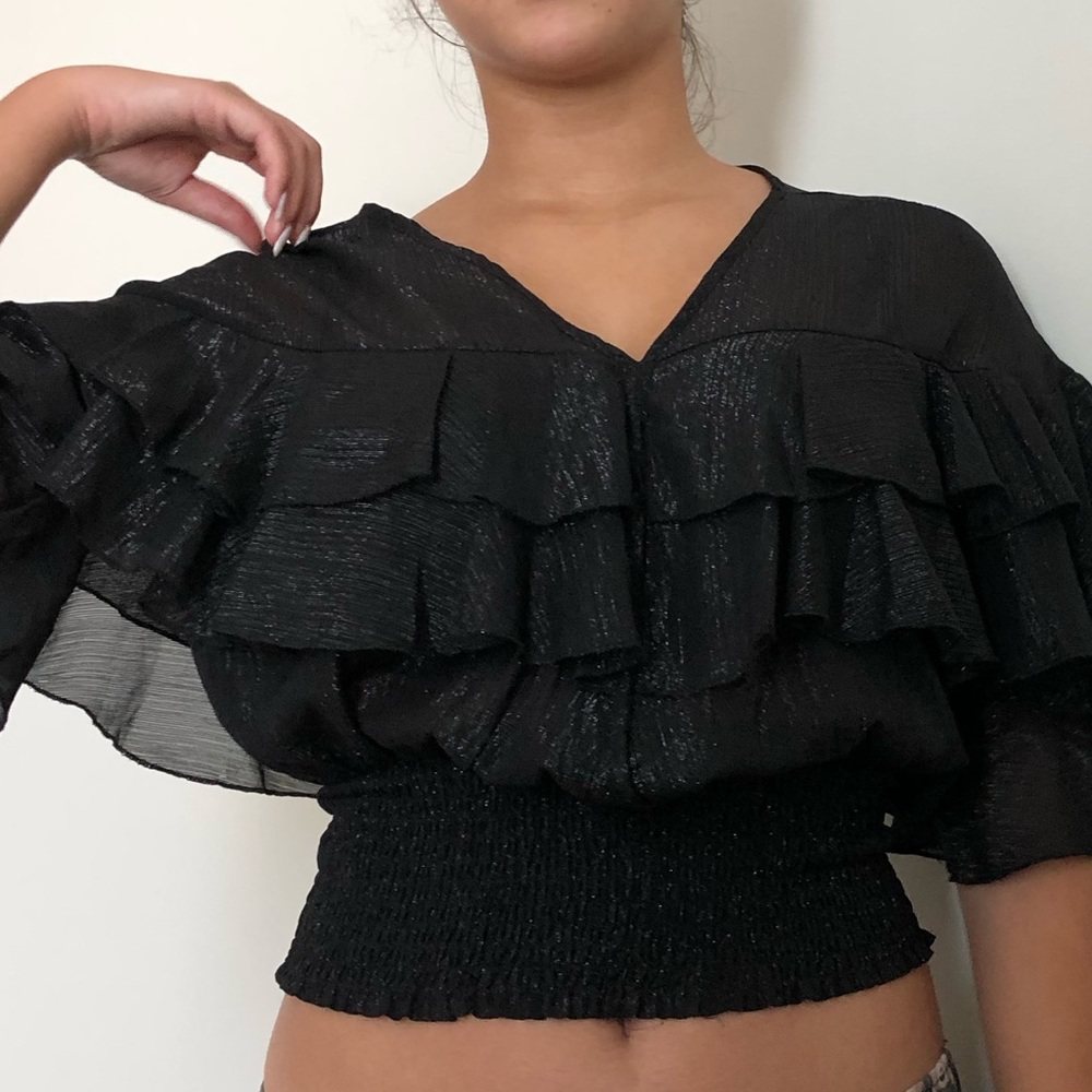 Black flowy shirt. Transparent. S
